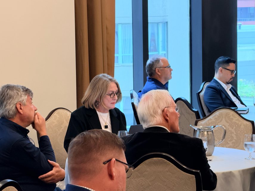 Roundtable participants listening during discussion