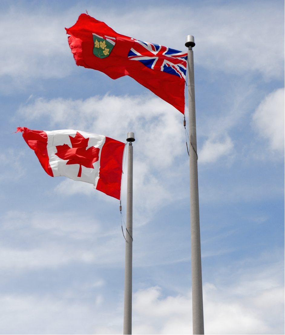 Ontario and Canada flags flying together